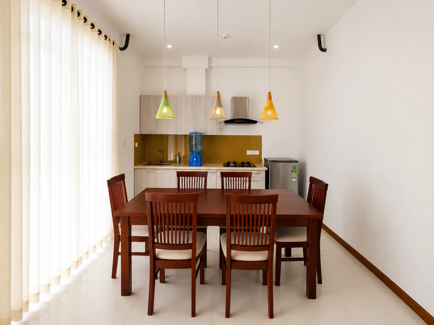 Living and dining area in the Signature Two Bedroom Apartment with City View